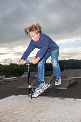 boy enjoys riding skateboard at the skatepark