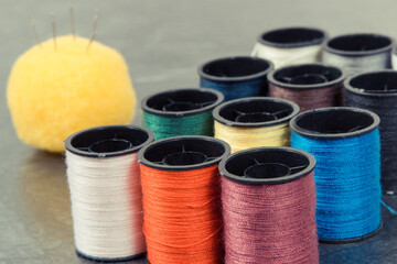 Spools of thread and needle. Accessories for embroidery and sewing