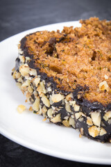 Homemade pastry made of zucchini with nuts and raisin on backgrond of concrete