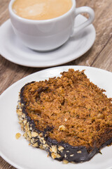 Zucchini dough and cup of white coffee on board. Delicious dessert