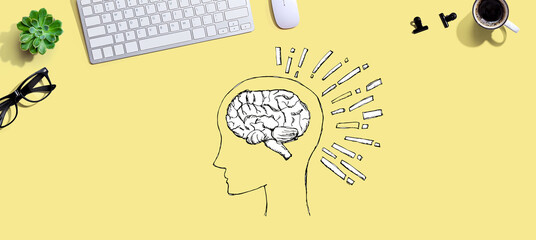 Brain illustration with a computer keyboard and a mouse