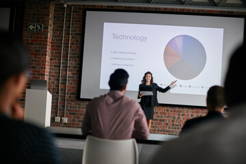 These points will be our focus in order of priority. Shot of a businesswoman giving a presentation to her colleagues.