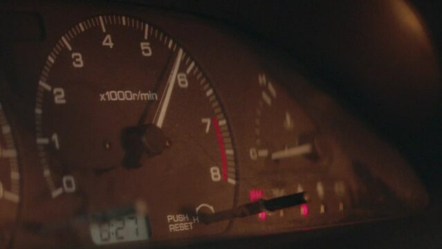 Close up of RPM speedometer rising in a speeding car