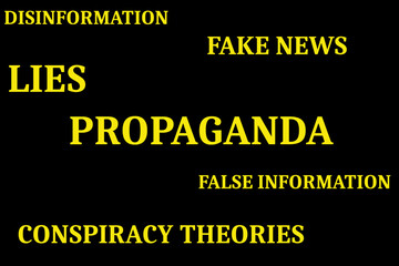 The words propaganda, fake news, disinformation, false information, lies and conspiracy theories in yellow on a black background - 492244944