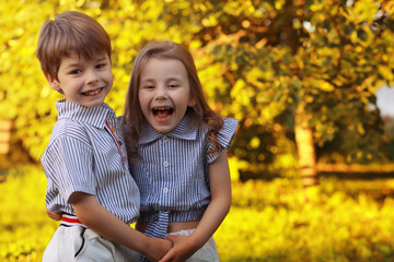 Children on a walk in the summer. Children indulge in the country. Laughter and splashing water.