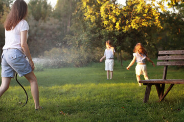 Children on a walk in the summer. Children indulge in the country. Laughter and splashing water.