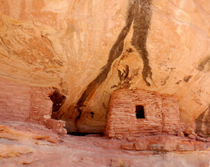 1200 year old Anasazi ruins tucked under a overhanging cliff in the Bears Ears wilderness area of...
