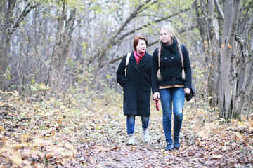 Young girl on a walk in the autumn