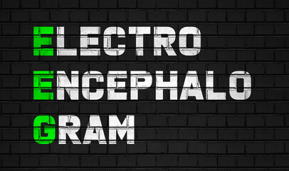 Obraz premium Electroencephalogram (EEG) concept,healthcare abbreviations on black wall