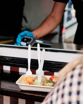 Worker using a dataphone in a food truck