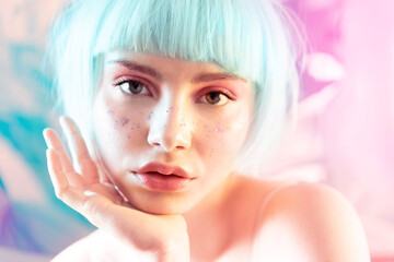 Modern sensual  blond european woman with short hair, perfect skin, contemporary makeup and glitter...