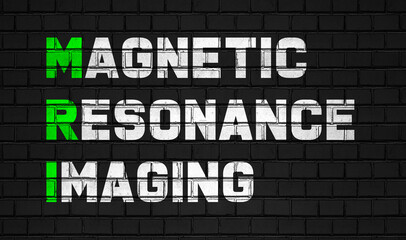 Magnetic resonance imaging(MRI) concept,healthcare abbreviations on black wall