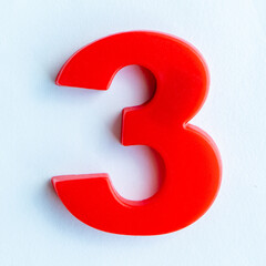plastic number three isolated on white background.