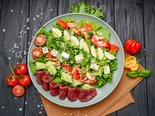 Vitello Tonnato, salad with veal carpaccio