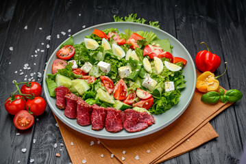 Vitello Tonnato, salad with veal carpaccio