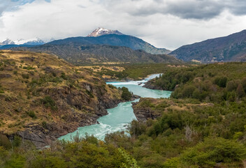 Fototapeta na wymiar The confluence of the Baker river (with bright turquoise waters) with the Neff river (with greyish waters) near the Patagonia National Park on route 7 (Carretera Austral), Cochrane, Patagonia, Chile