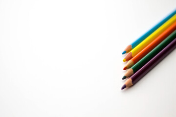 colorful pencils on white background. copy space.