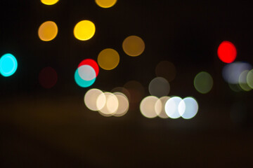 blurry traffic lights in the night