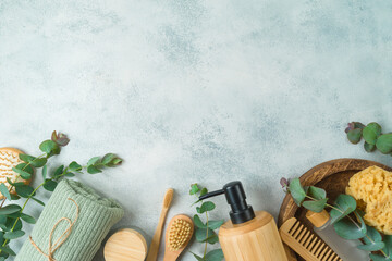 Zero waste concept. Body care products with eucalyptus branches on gray concrete background. Top...