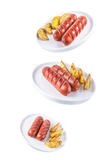 Fried sausages with roasted potatoes in a plate on a white isolated background