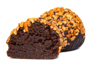Cake rum truffle two balls with chopped nuts isolated on the white background