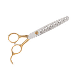 Scissors for cutting people and pets. Grooming scissors. Closed scissors on a white isolated background. Side view.