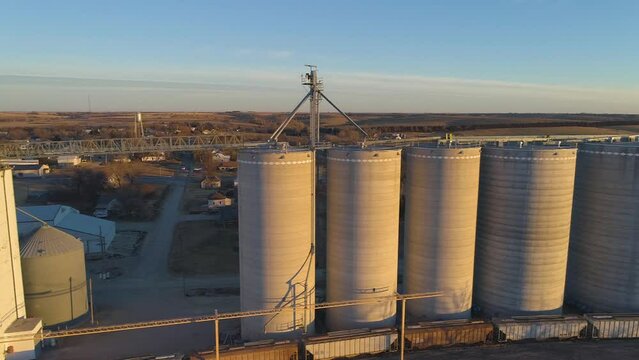 Drone view of grain elevator storage facility in small town