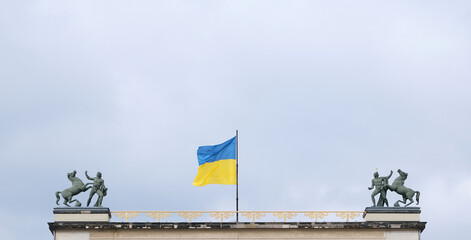 Berlin, Germany, March 4, 2022, Ukrainian flag as a sign of solidarity over the old museum.