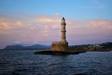 lighthouse at sunset in old Venetian Harbor in Chania Crete Greece 