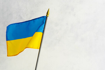On a white background the state flag of Ukraine. There is an empty space to insert. Fight for independence, Constitution Day, free peaceful state, Russian aggression against Ukraine.