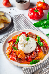Burrata cheese with baked tomatoes, pepper, red onion and fresh
