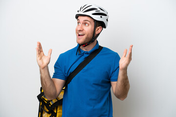 Young caucasian man with thermal backpack isolated on white background with surprise facial expression