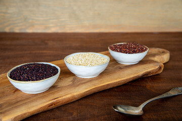 Quinoa of different colors: white, red and black in a bowl. Healthly gluten free grains.