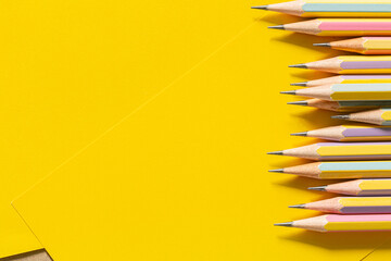 wooden pencil on yellow background,Colorful pencils at border of banner yellow background