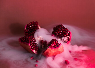 a cut garnet with smoke on a red background