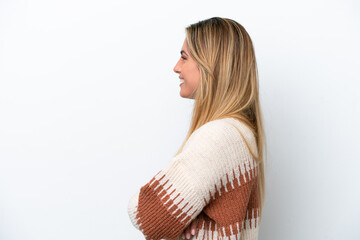 Young caucasian woman isolated on white background in lateral position