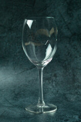 Broken wine glass standing alone
