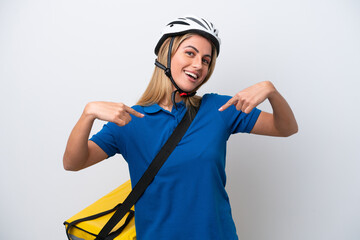 Young caucasian woman with thermal backpack isolated on white background proud and self-satisfied