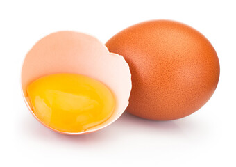 Broken brown egg in eggshell half isolated on white background