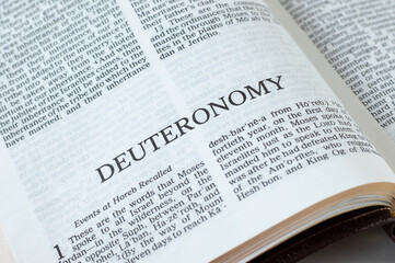 Deuteronomy open Holy Bible Book close-up. Old Testament Scripture. Studying the Word of God Jesus Christ. Christian biblical concept of faith, hope, and trust. 