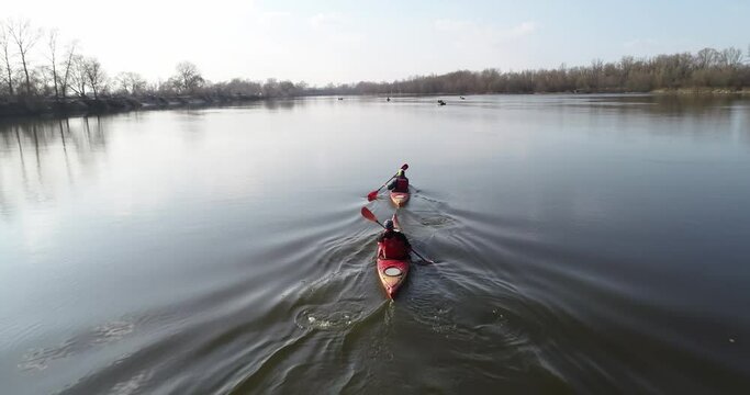 Ukraine. Kyiv. A couple on a canoe float on the river. Autumn. Desna river