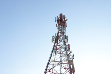 Modern mobile tower against the blue sky. Modern technologies. 5G.