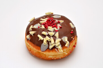 donut in chocolate glaze on a white background close-up