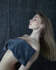 Obraz premium Woman in jacket posing in studio