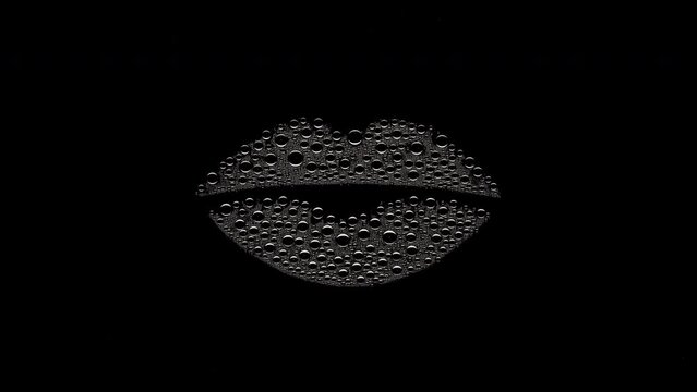 Lip shape printed on the wet glass blown off with air stream on black background | lip care concept