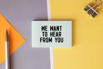 calculator, pen, glasses and notepad with text we want to hear from you