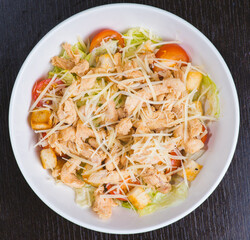 Salad with chicken meat. Fresh vegetable salad with chicken breast. Meat salad with chicken fillet and fresh vegetables on plate