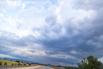 blue sky background with clouds. Wide sky panorama with scattered cumulus clouds