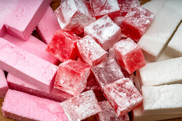 Jelly bites sweet, fruit flavored confectionery coated with powdered sugar. Toffee candied fruit...