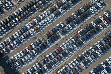 Diagonal aerial view on cars on the parking lot on a bright summer day